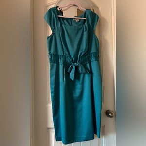 Beautiful teal women’s cocktail dress. Knee length, cap sleeve, size 14.